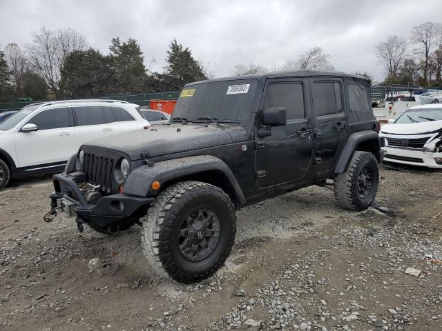 1J8GA59179L757017 - 2009 JEEP WRANGLER U SAHARA BLACK photo 1