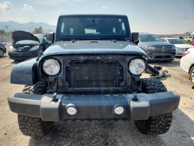 1C4BJWEG9EL223349 - 2014 JEEP WRANGLER U SAHARA BLACK photo 5