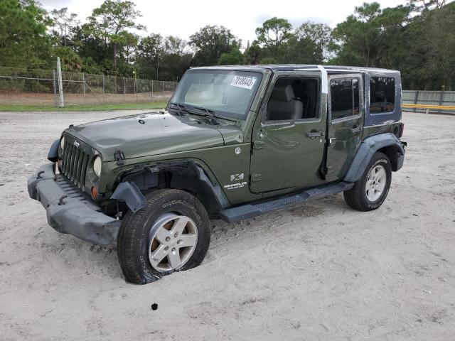 1J4GA39159L748743 - 2009 JEEP WRANGLER U X GREEN photo 1