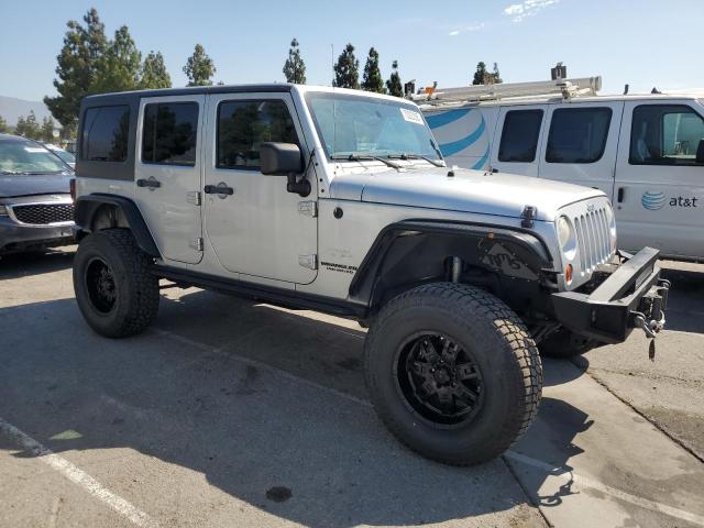 1J4BA5H16BL521963 - 2011 JEEP WRANGLER U SAHARA SILVER photo 4