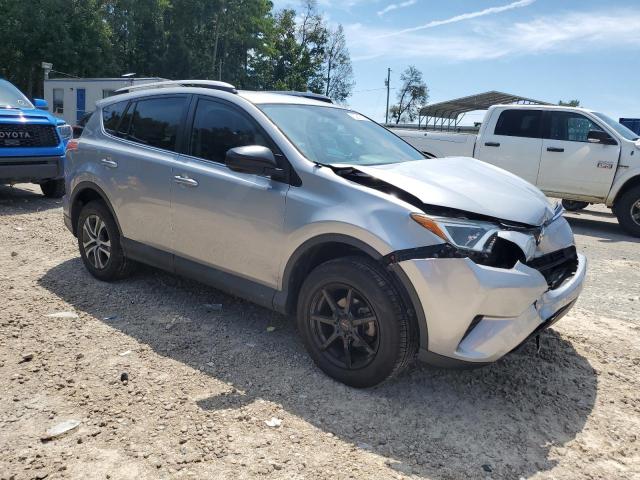 2T3ZFREV8GW283977 - 2016 TOYOTA RAV4 LE SILVER photo 4