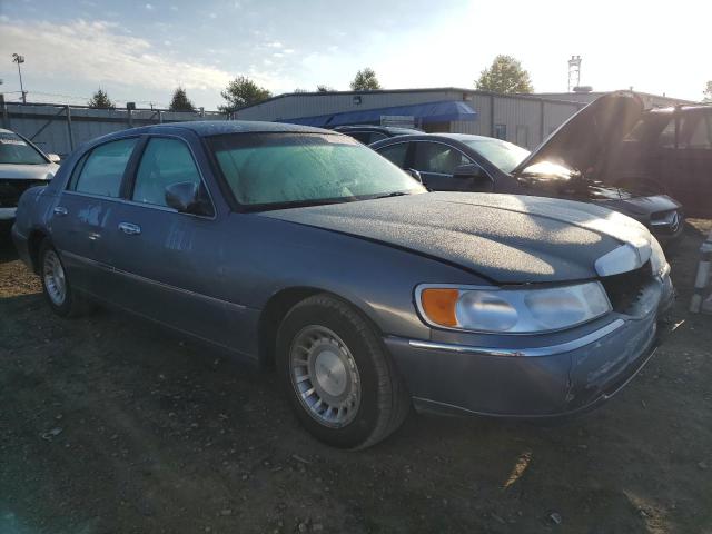 1LNHM81W4XY717727 - 1999 LINCOLN TOWN CAR EXECUTIVE GRAY photo 4