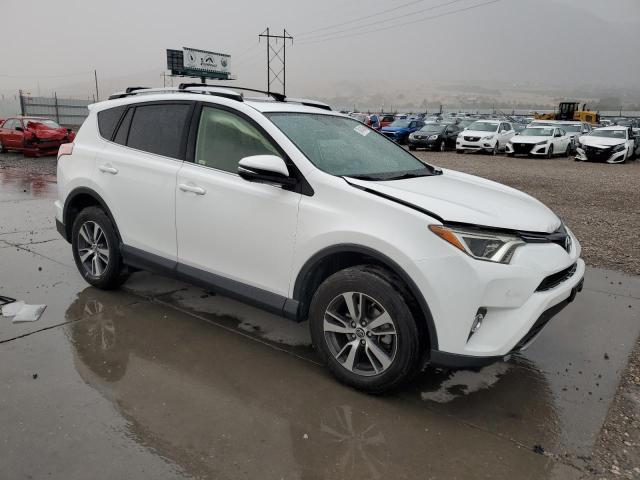 JTMWFREV5GJ078814 - 2016 TOYOTA RAV4 XLE WHITE photo 4