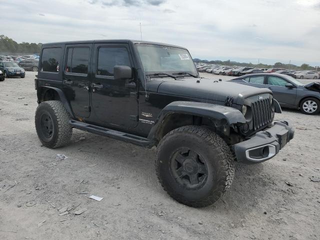 1C4BJWEG1CL183880 - 2012 JEEP WRANGLER U SAHARA BLACK photo 4