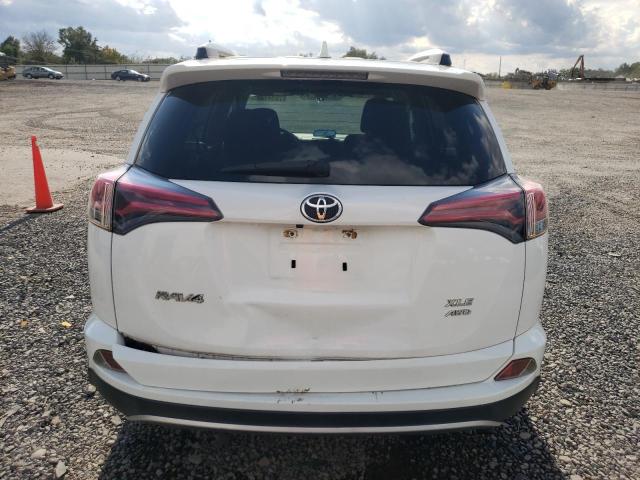 JTMRFREV3GJ100807 - 2016 TOYOTA RAV4 XLE WHITE photo 6