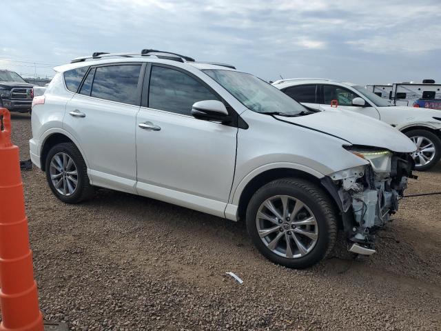 2T3YFREV6HW324426 - 2017 TOYOTA RAV4 LIMITED WHITE photo 4