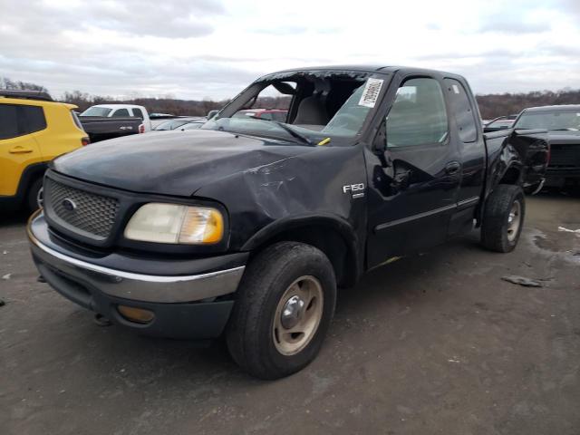 1FTRX18LXYNB43995 - 2000 FORD 150 BLACK photo 1