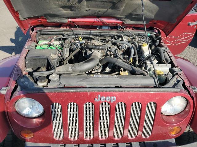 1J4BA5H17BL593450 - 2011 JEEP WRANGLER U SAHARA წითელი ფოტო 11