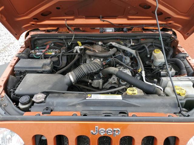 1J4AA2D12AL225577 - 2010 JEEP WRANGLER SPORT ORANGE photo 11