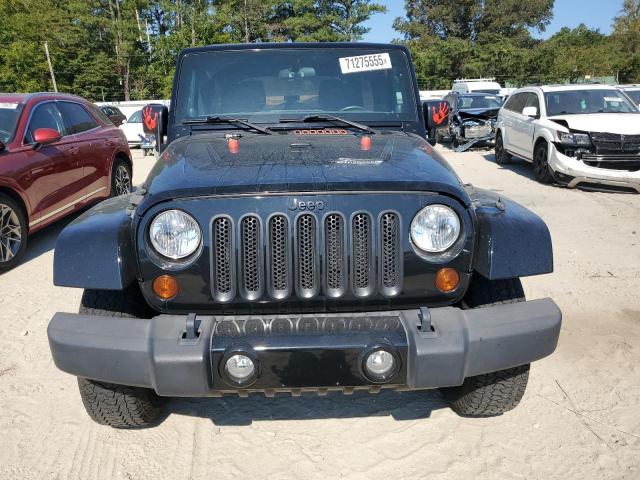 1C4BJWEG3CL280529 - 2012 JEEP WRANGLER U SAHARA შავი ფოტო 5