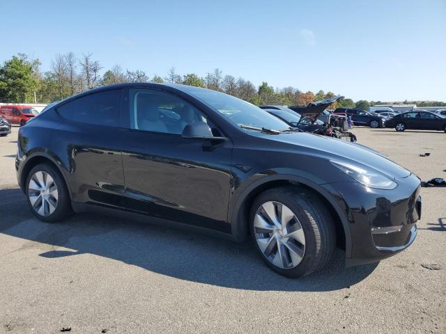 7SAYGDEE8PA184562 - 2023 TESLA MODEL Y Schwarz Foto 4
