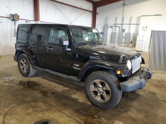 1C4BJWEG4GL305010 - 2016 JEEP WRANGLER U SAHARA BLACK photo 4