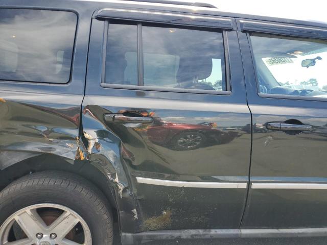 1J4NT1GA3AD625823 - 2010 JEEP PATRIOT SPORT BLACK photo 11