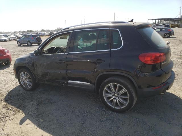 WVGAV7AX5CW582524 - 2012 VOLKSWAGEN TIGUAN S BLACK photo 2