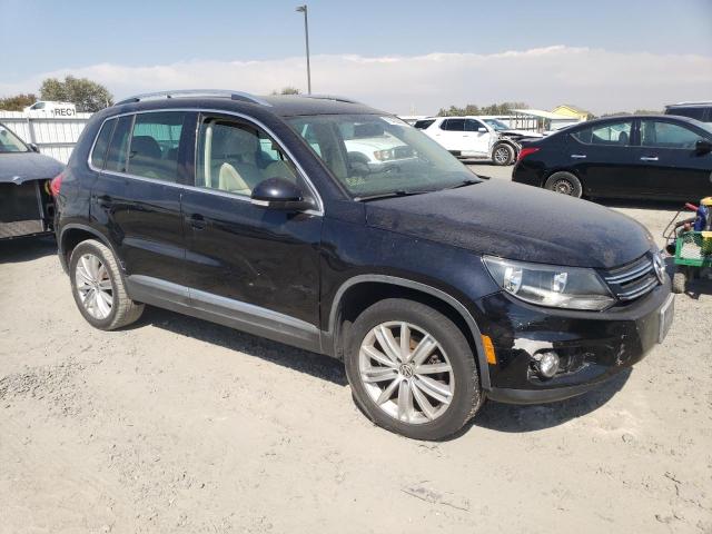 WVGAV7AX5CW582524 - 2012 VOLKSWAGEN TIGUAN S BLACK photo 4