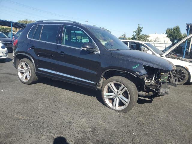 WVGAV7AX6GW038944 - 2016 VOLKSWAGEN TIGUAN S BLACK photo 4
