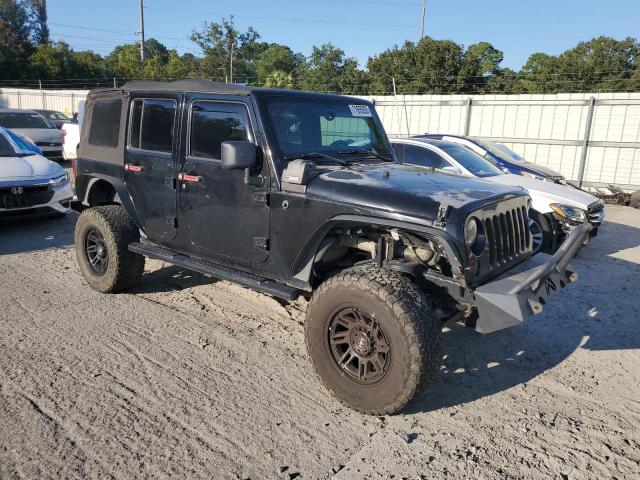 1J4BA3H1XBL506449 - 2011 JEEP WRANGLER U SPORT أسود صورة 4