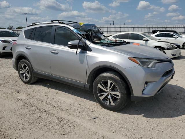 2T3WFREV9GW310607 - 2016 TOYOTA RAV4 XLE SILVER photo 4