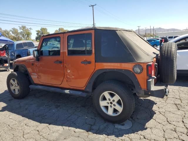 1J4BA3H19AL172820 - 2010 JEEP WRANGLER U SPORT Оранжевый фото 2