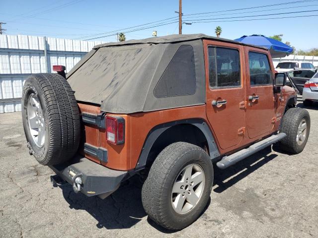 1J4BA3H19AL172820 - 2010 JEEP WRANGLER U SPORT Оранжевый фото 3
