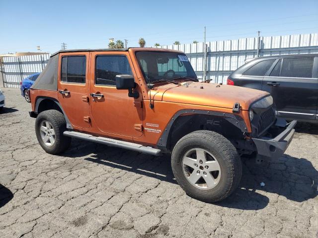 1J4BA3H19AL172820 - 2010 JEEP WRANGLER U SPORT Оранжевый фото 4