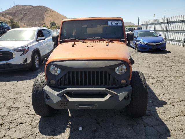 1J4BA3H19AL172820 - 2010 JEEP WRANGLER U SPORT Оранжевый фото 5