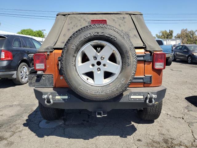 1J4BA3H19AL172820 - 2010 JEEP WRANGLER U SPORT Оранжевый фото 6