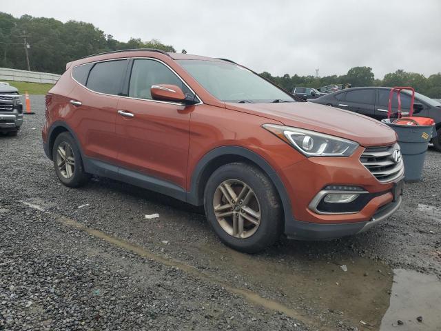 5XYZU3LB2JG522764 - 2018 HYUNDAI SANTA FE S ORANGE photo 4