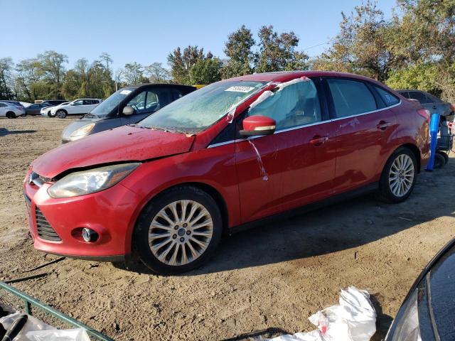 1FAHP3J21CL145296 - 2012 FORD FOCUS TITANIUM RED photo 1