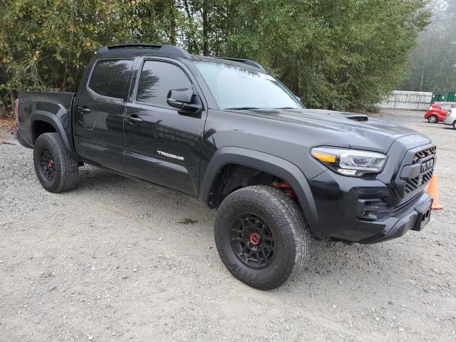 3TYCZ5AN4NT069292 - 2022 TOYOTA TACOMA DOUBLE CAB BLACK photo 4
