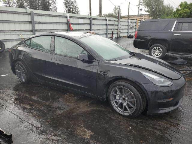 5YJ3E1EA3PF385877 - 2023 TESLA MODEL 3 BLACK photo 4