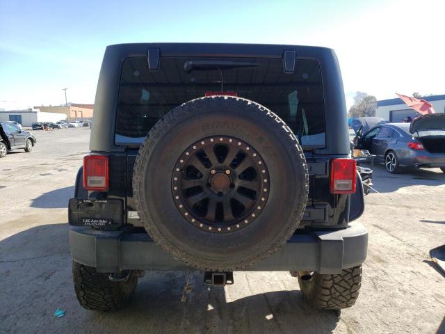 1C4BJWDG9CL142625 - 2012 JEEP WRANGLER U SPORT Schwarz Foto 6