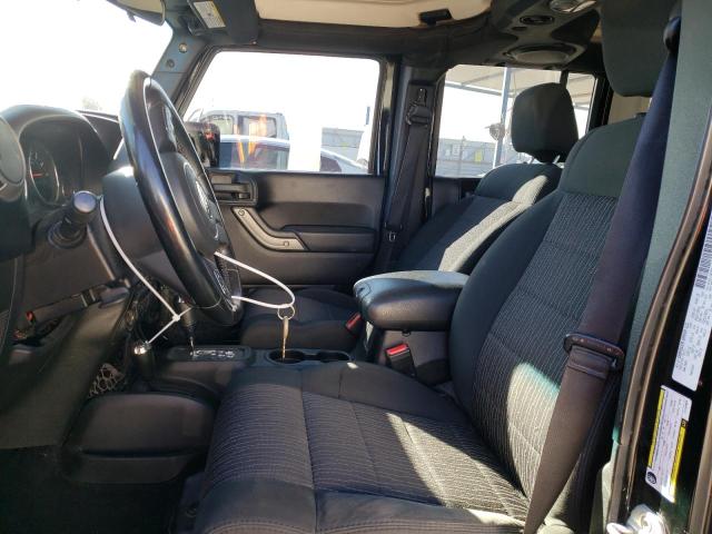 1C4BJWDG9CL142625 - 2012 JEEP WRANGLER U SPORT Schwarz Foto 7