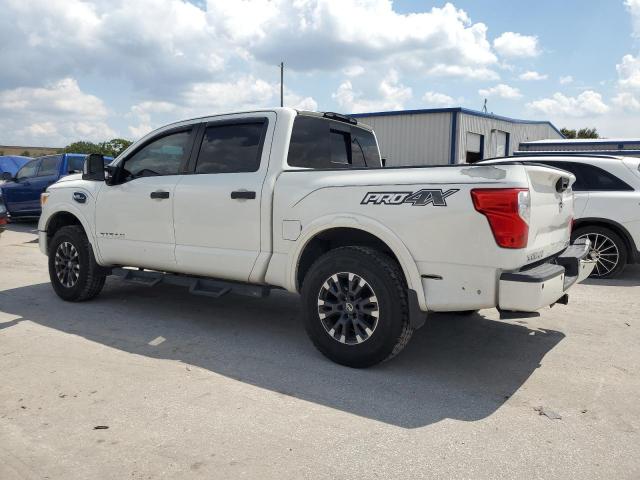 1N6AA1E50HN555537 - 2017 NISSAN TITAN SV WHITE photo 2