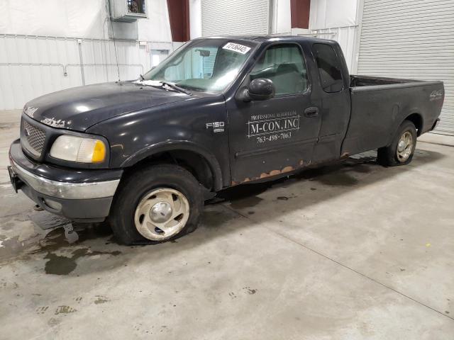 1FTRX18LXYNA92725 - 2000 FORD F-150 BLACK photo 1