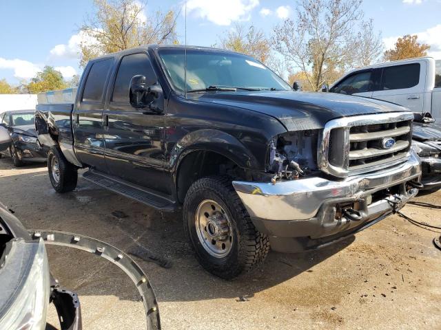 1FTSW31F91ED39422 - 2001 FORD F350 SRW SUPER DUTY BLACK photo 4