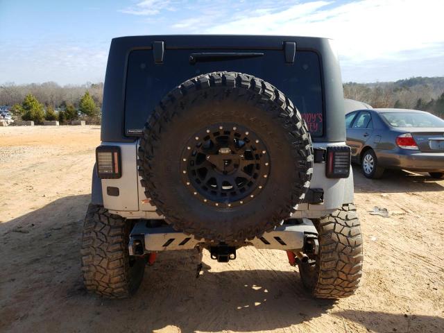 1C4HJWDG8GL346106 - 2016 JEEP WRANGLER U SPORT Сірий фото 6