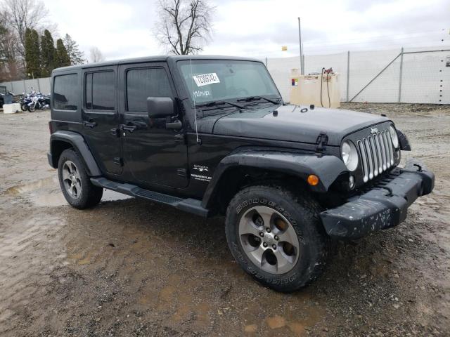 1C4BJWEG1GL210517 - 2016 JEEP WRANGLER U SAHARA BLACK photo 4