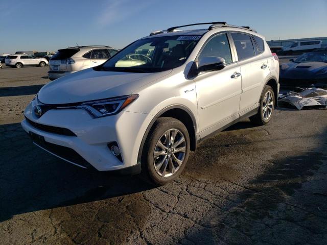 JTMDJREV8JD229740 - 2018 TOYOTA RAV4 HV LIMITED WHITE photo 1