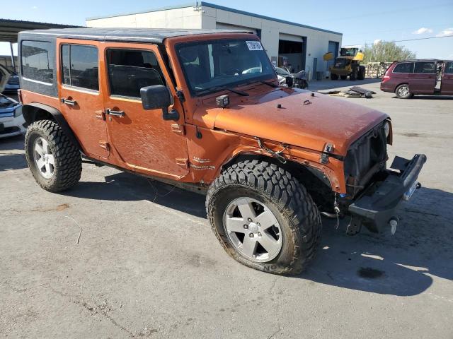 1J4BA5H19BL588797 - 2011 JEEP WRANGLER U SAHARA ORANGE photo 4