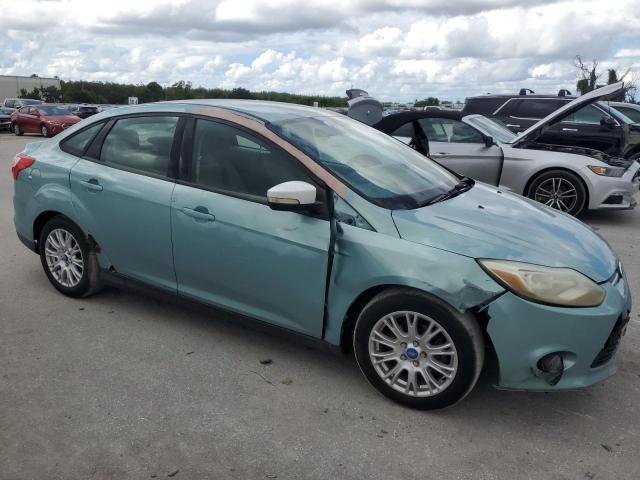 1FAHP3F21CL333230 - 2012 FORD FOCUS SE TURQUOISE photo 4