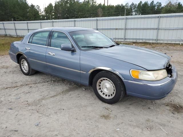 1LNHM81W4XY699035 - 1999 LINCOLN TOWN CAR EXECUTIVE BLUE photo 4