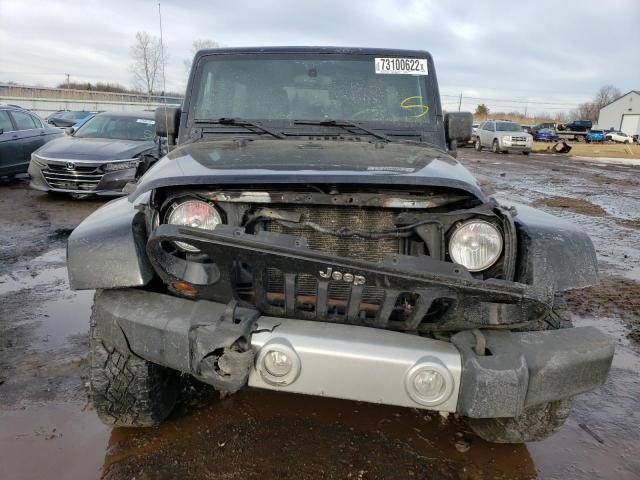 1J4BA5H16BL636322 - 2011 JEEP WRANGLER U SAHARA BLACK photo 5