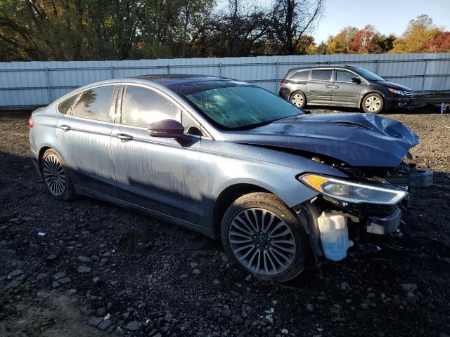 3FA6P0D99JR212367 - 2018 FORD FUSION TITANIUM/PLATINUM BLUE photo 4