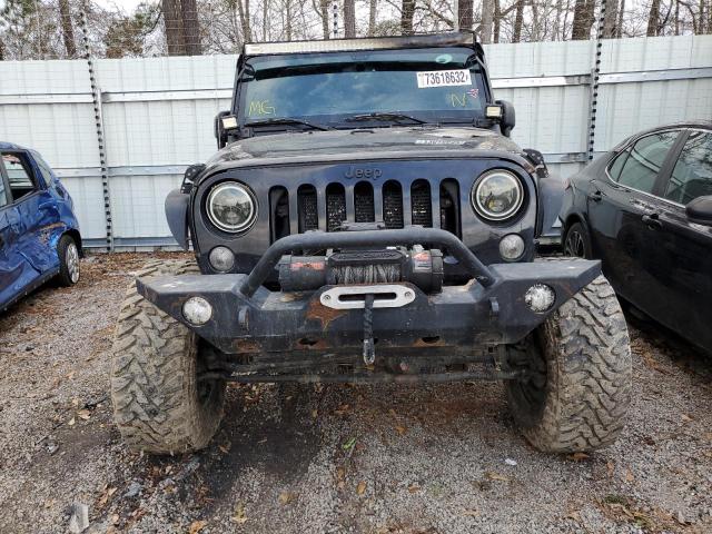 1C4BJWDG8GL139771 - 2016 JEEP WRANGLER U SPORT შავი ფოტო 5