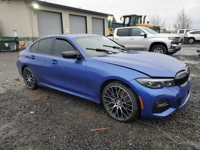 3MW5R7J01N8C32815 - 2022 BMW 330XI BLUE photo 4