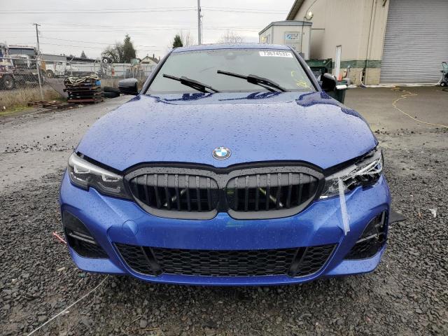 3MW5R7J01N8C32815 - 2022 BMW 330XI BLUE photo 5