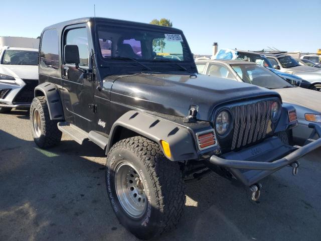 1J4FA29P7YP717253 - 2000 JEEP WRANGLER / SE BLACK photo 4