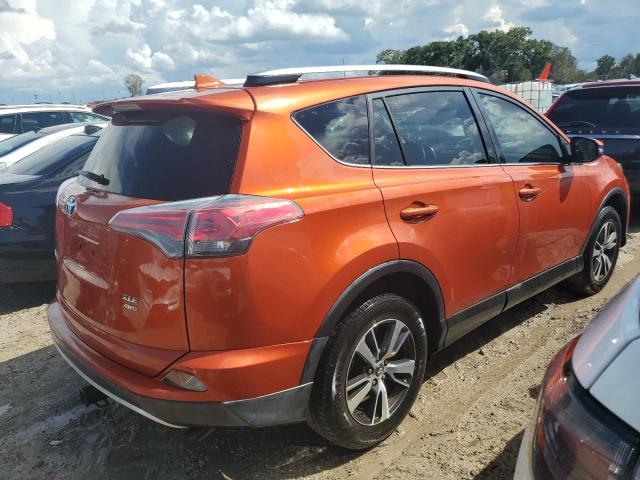 JTMRFREV0GJ080189 - 2016 TOYOTA RAV4 XLE ORANGE photo 3