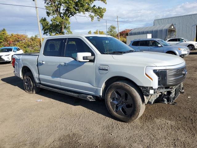 1FT6W1EV0PWG38145 - 2023 FORD F150 LIGHTNING PRO GRAY photo 4